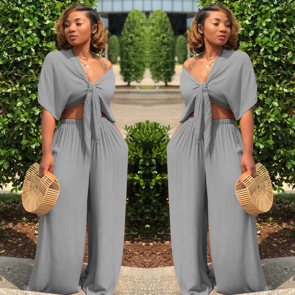 A two-piece solid color wide-leg trouser suit