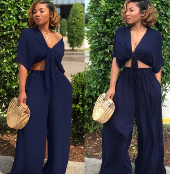 A two-piece solid color wide-leg trouser suit