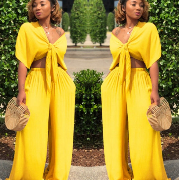 A two-piece solid color wide-leg trouser suit