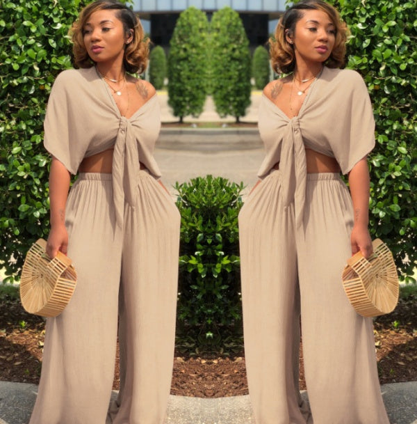 A two-piece solid color wide-leg trouser suit