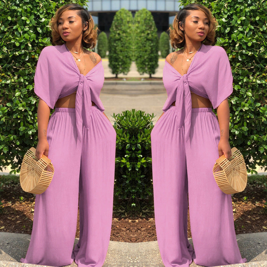 A two-piece solid color wide-leg trouser suit