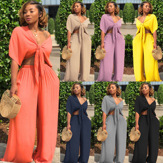 A two-piece solid color wide-leg trouser suit