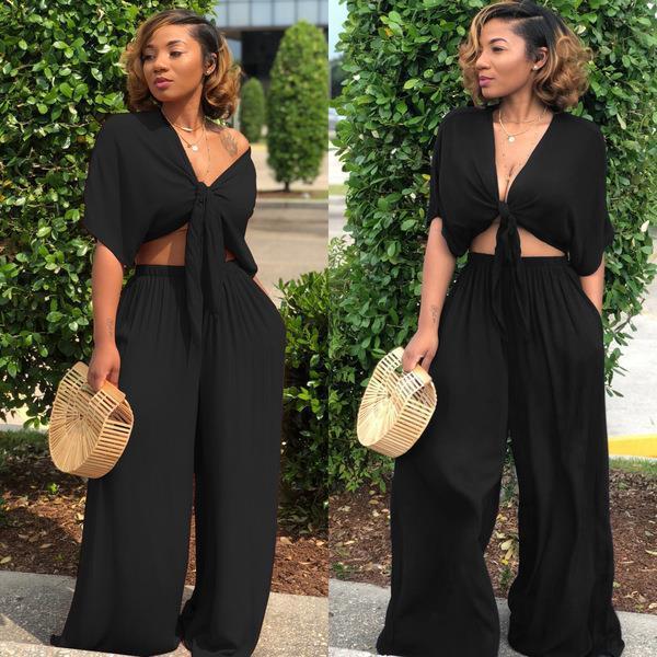 A two-piece solid color wide-leg trouser suit
