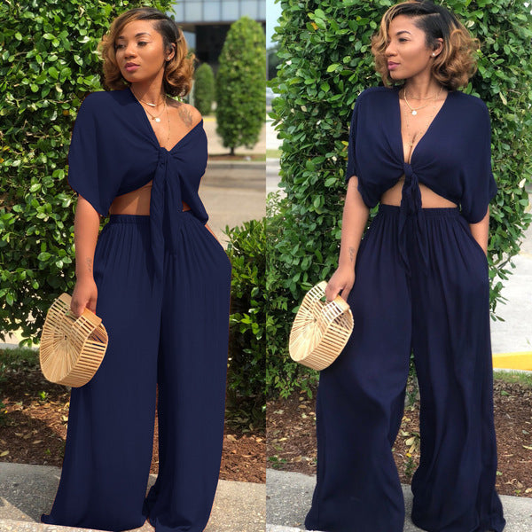 A two-piece solid color wide-leg trouser suit